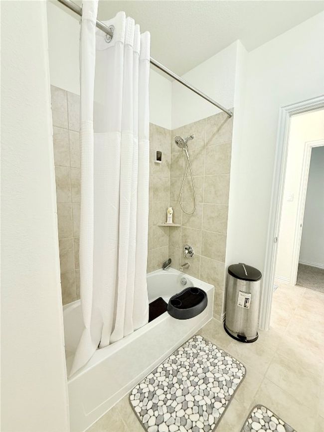 Jack and Jill Bathroom featuring shower / bath combo | Image 35