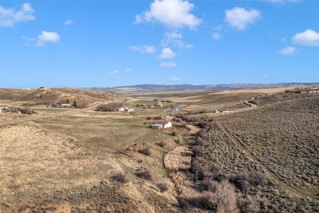 View of mountain backdrop with rural landscape | Image 26
