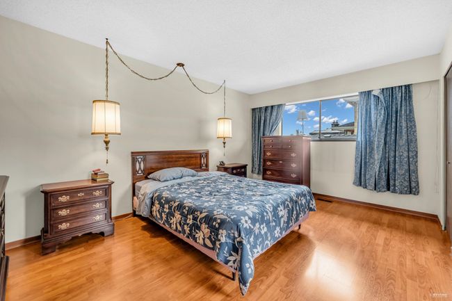 Bedroom with wood finished floors and baseboards | Image 17