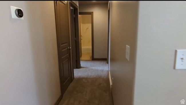 Hall featuring carpet floors | Image 72