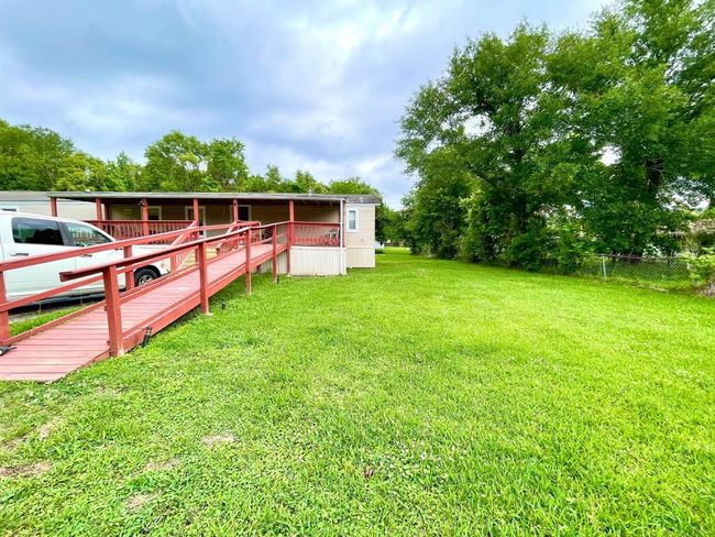 You can enter by the newly rebuilt patio stair or this accessible ramp | Image 5