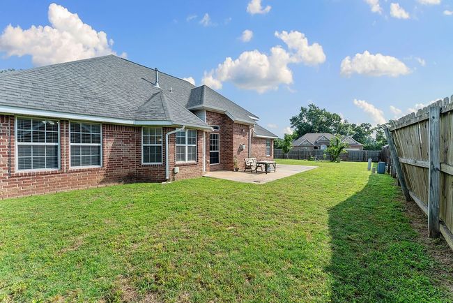 Backyard with large concrete patio | Image 17