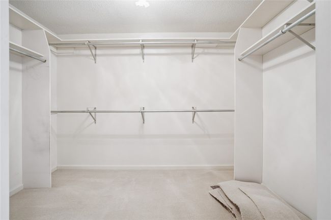 PRIMARY BEDROOM WALK IN CLOSET | Image 20