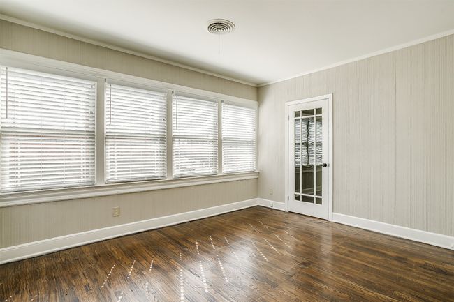 Empty room with wood-type flooring and ornamental molding | Image 14