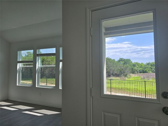 Doorway with wood finished floors and baseboards | Image 9