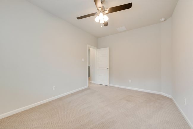 Spare room featuring visible vents, ceiling fan, light colored carpet, and baseboards | Image 23