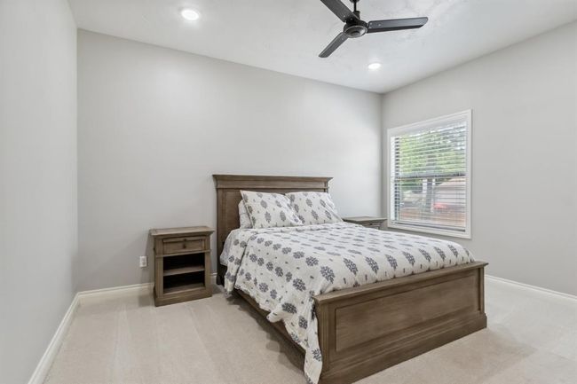 Located upstairs, you'll find another well-sized secondary bedroom. | Image 32