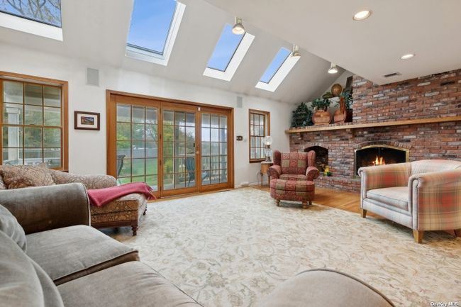 Living Room with Fireplace Opens to Rear Covered Porch ... | Image 5