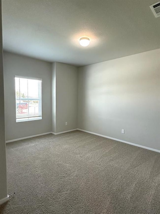 Carpeted spare room featuring baseboards | Image 12