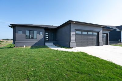 View of front of house featuring a garage and a front yard | Image 3