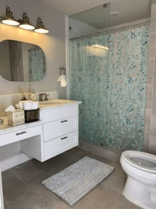 Bathroom featuring tile patterned flooring, vanity, and a stall​​‌​​​​‌​​‌‌​‌‌​​​‌‌​​‌‌​‌​​​​​‌ shower | Image 9