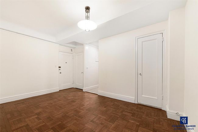 Unfurnished room with baseboards | Image 7