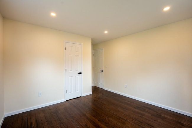 Unfurnished bedroom #2 featuring baseboards, dark wood finished floors, visible vents, and recessed lighting | Image 16