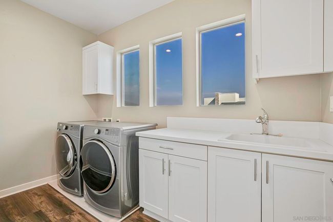 Spacious laundry room at upper level | Image 24
