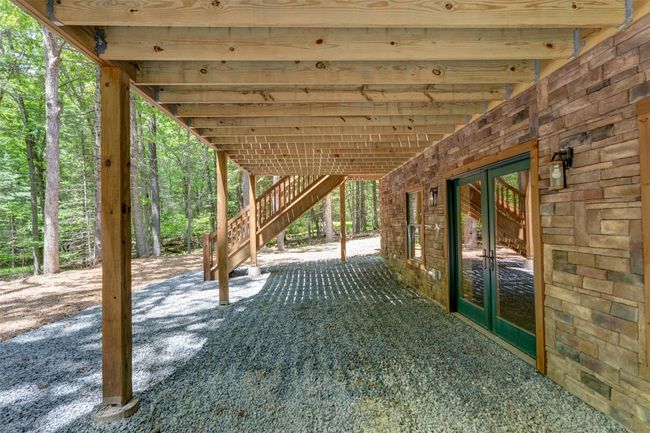 View of patio / terrace featuring french doors and stairs | Image 42
