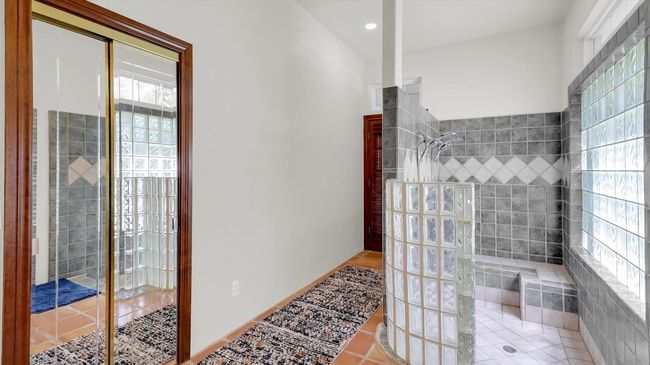 Walk in shower and exit to screen porch. | Image 28