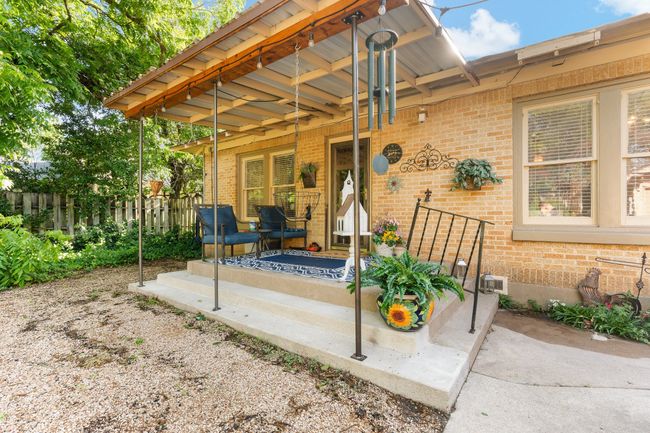 Entrance to property featuring a porch and brick siding | Image 28