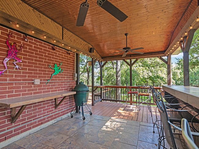 230 s.f. outdoor kitchen and dining area. Ceiling fans, grill, countertops & sink. | Image 32