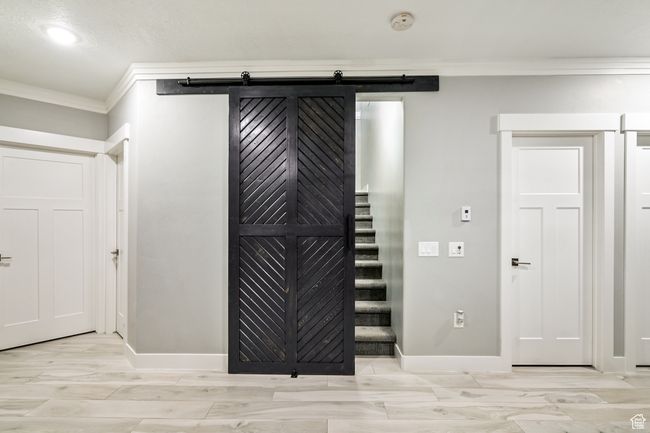 Detailed view of ornamental molding, a smoke detector, and recessed lighting | Image 60