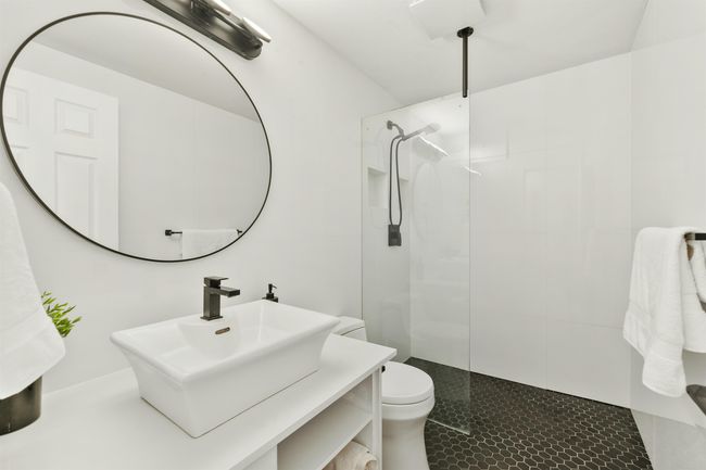 Bathroom featuring vanity, toilet, and a walk in shower | Image 18