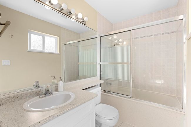 Full bathroom with vanity and combined bath / shower with glass door | Image 22