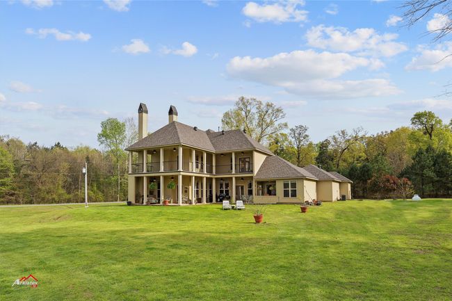 Rolling lawn from the lake to the house. | Image 17