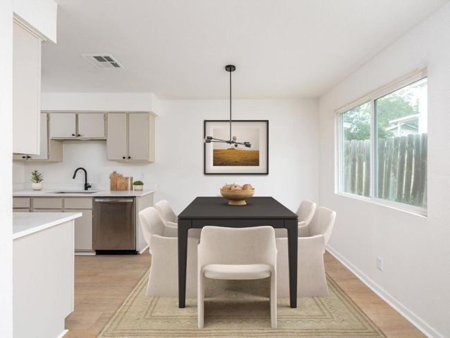 Dining room with light wood-type flooring and baseboards | Image 8