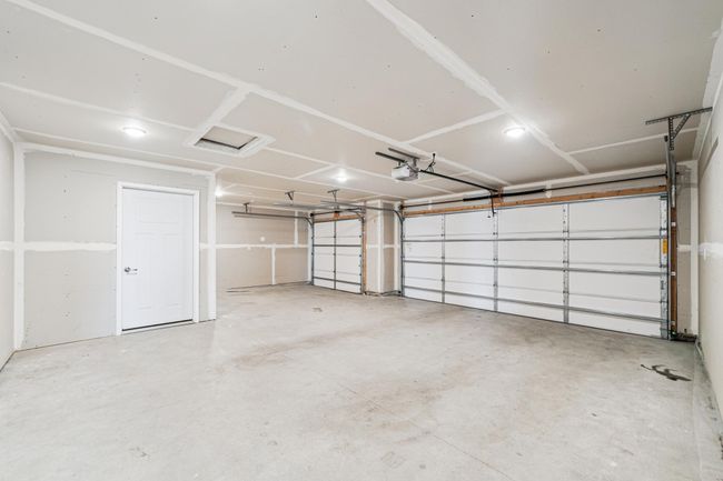 Garage is insulated. 3-stalls, 3rd could fit a small car or used for storage. | Image 25