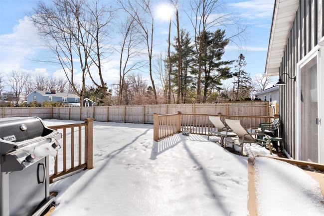 Yard layered in snow featuring a fenced backyard | Image 35