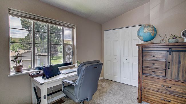Office featuring vaulted ceiling and carpet | Image 26