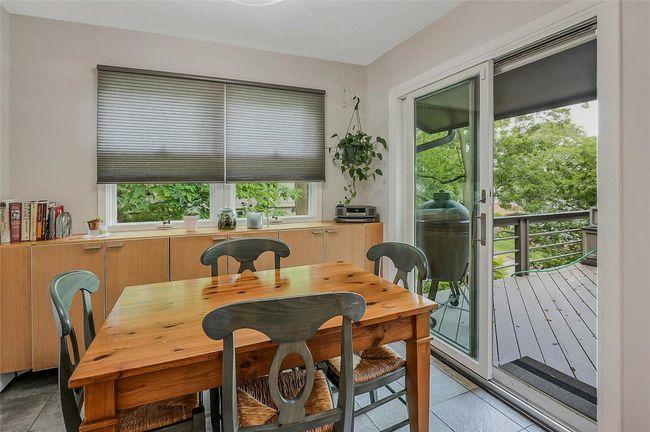 Dining area featuring light tile patterned floors | Image 15