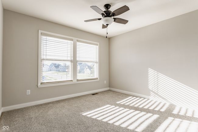 spare room with visible vents, baseboards, carpet, and ceiling fan | Image 32