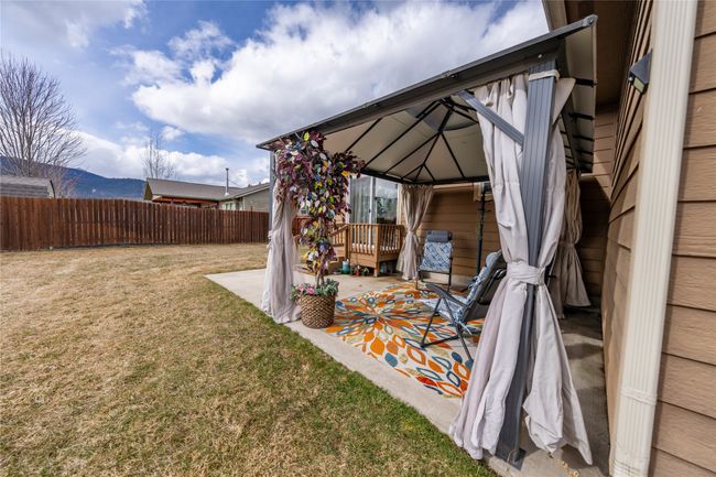 View of yard with a gazebo, a patio area, and fence | Image 27