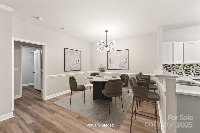 Primary suite is just off living and dining area | Image 22