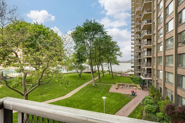 View of home's community with a lawn | Image 19