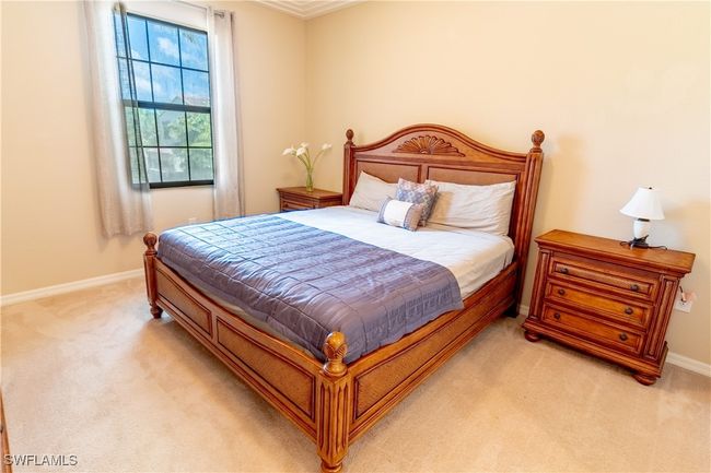 Bedroom with baseboards and light colored carpet | Image 14