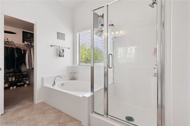Bathroom with a bath, a shower stall, tile patterned flooring, and a spacious closet | Image 52