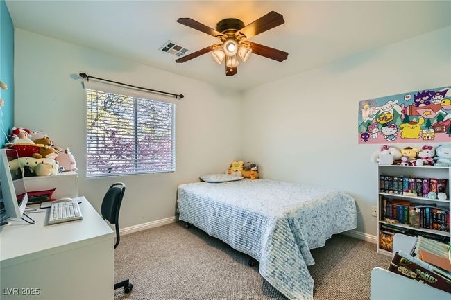 Second bedroom with a ceiling light/fan and carpeting | Image 17