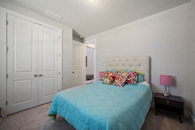 Carpeted bedroom with a closet | Image 6