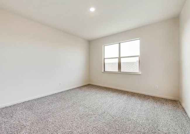 Spare room with light carpet and baseboards | Image 6
