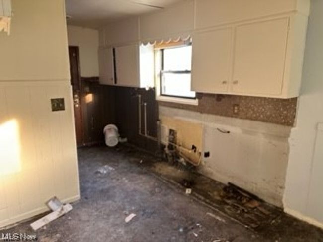 Kitchen with white cabinetry | Image 6