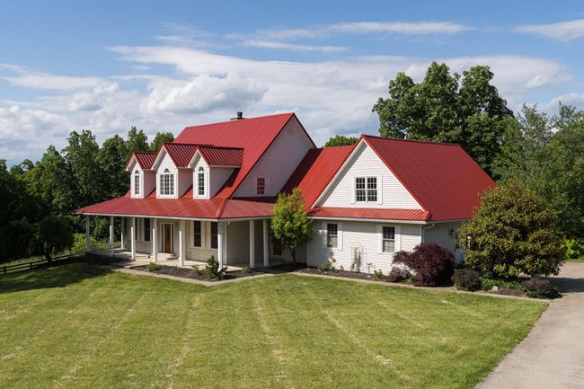 Eye Catching curb appeal with red metal roof. | Image 6
