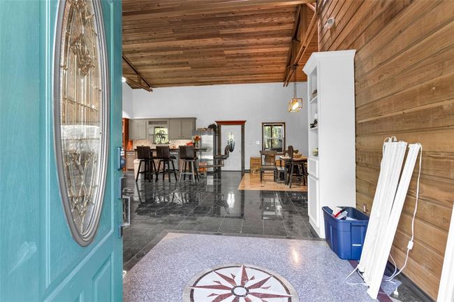 Great view of the detailed tile work from the front door | Image 8