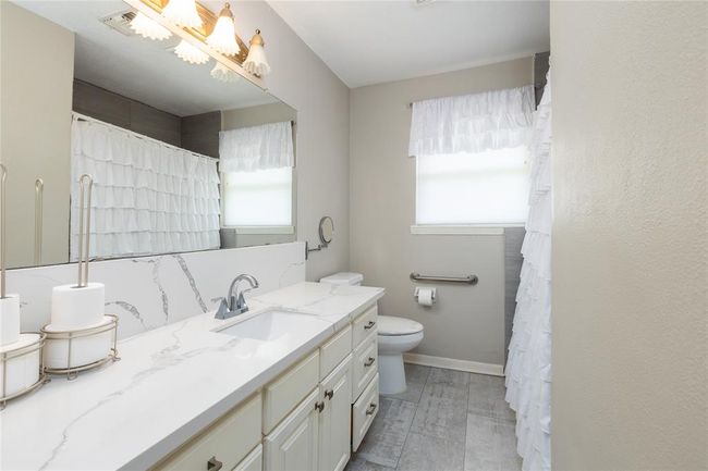 Hall Bathroom has been updated with granite counter top and sink | Image 19