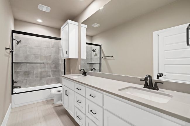 Full bathroom with double vanity, shower combination, and recessed lighting | Image 22