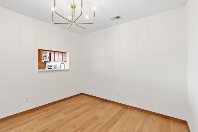 Private dining area with a pass through window to the kitchen. | Image 5