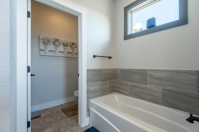 Full bath featuring a garden tub and tile patterned floors | Image 16