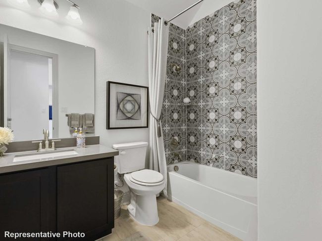 Full bath featuring toilet, vanity, and shower / bathtub combination with curtain | Image 14