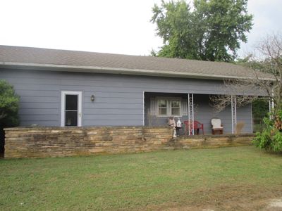 View of front facade with a front lawn | Image 1