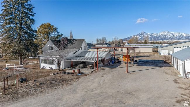 Rear view of property with a mountain view and an outdoor structure | Image 39